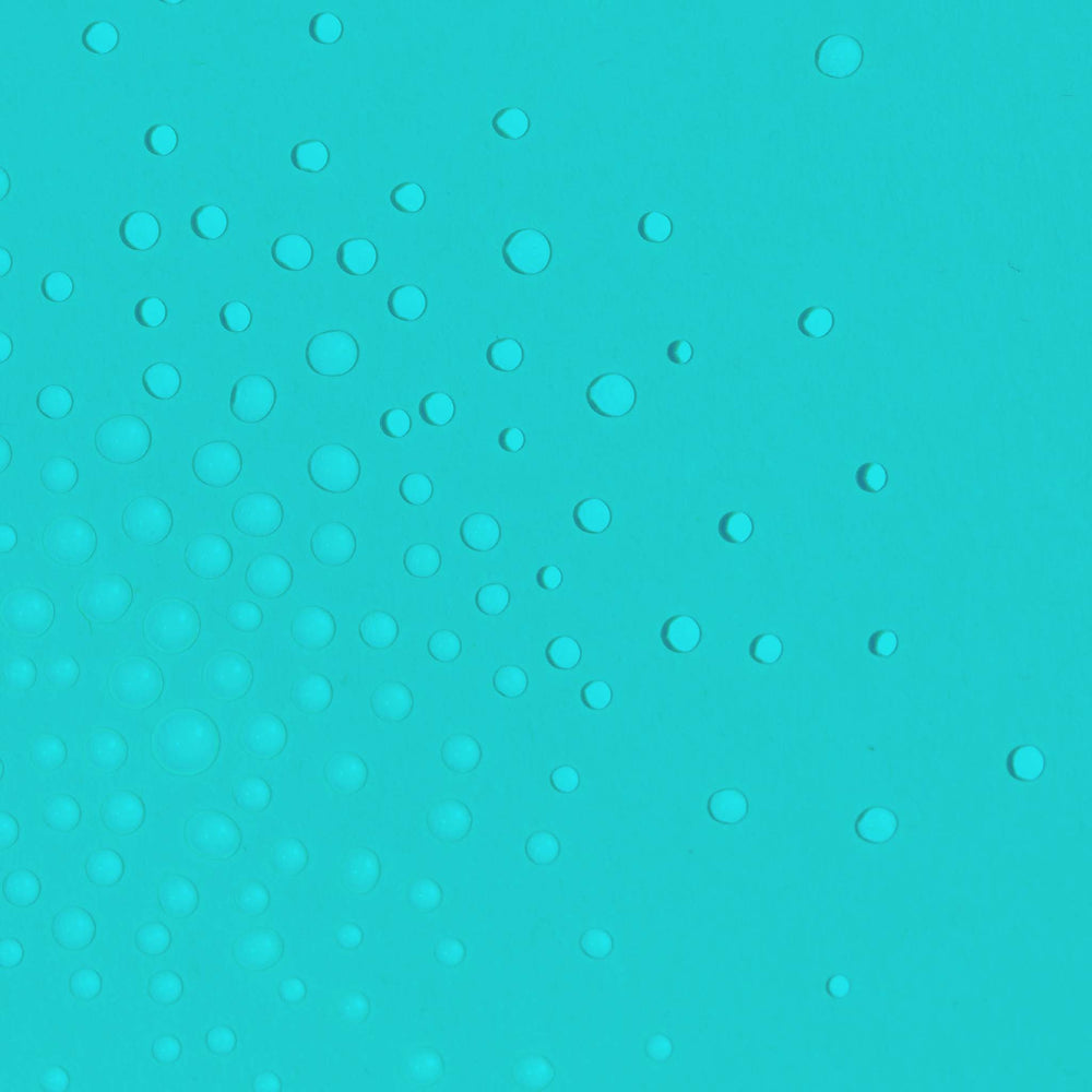 Turquoise textured surface with circular patterns