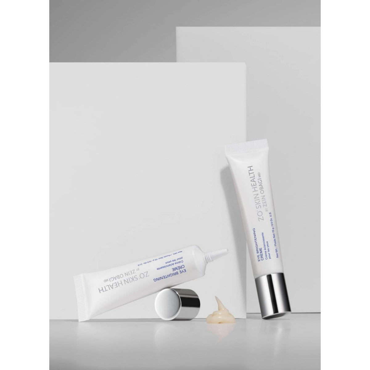 Two white tubes of ZO Skin Health Eye Brightening Creme 15g